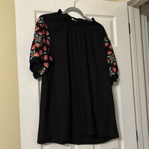 Black top with embroidered sleeves